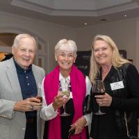 Tom and Joyce Beck posing for photo with Kelly Beck-Kruse
